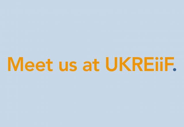 Blue background with text Meet us at UKREiF