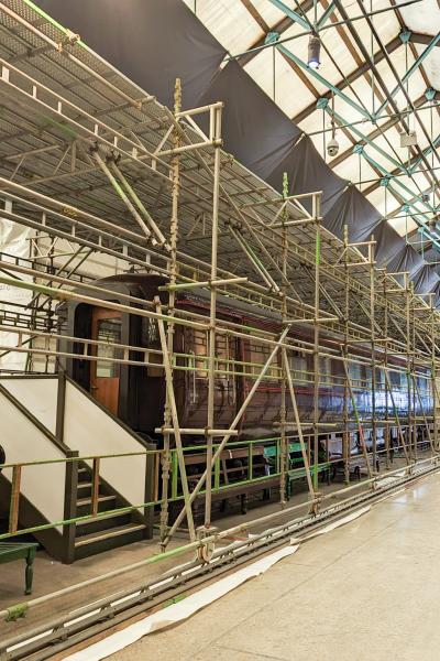 Victorian train being covered by scaffolding 