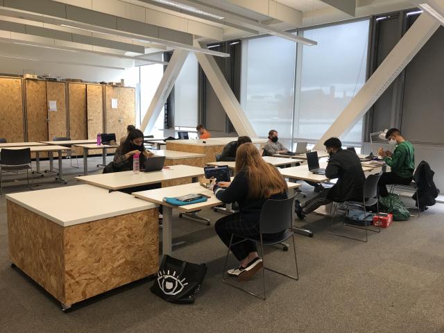 university classroom with six students at desk