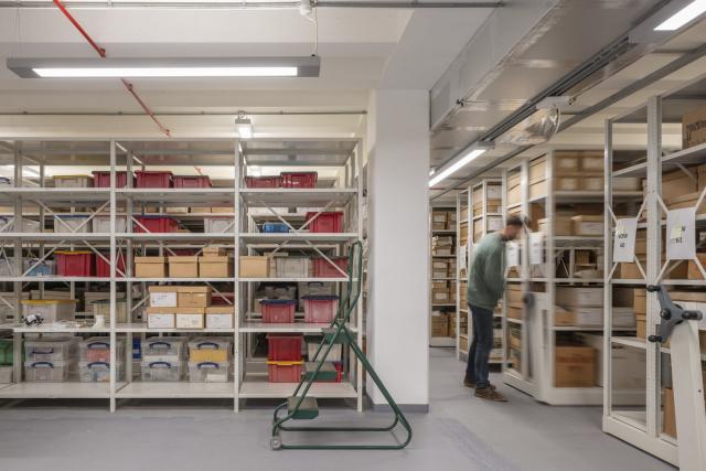 Man in an archive storage space