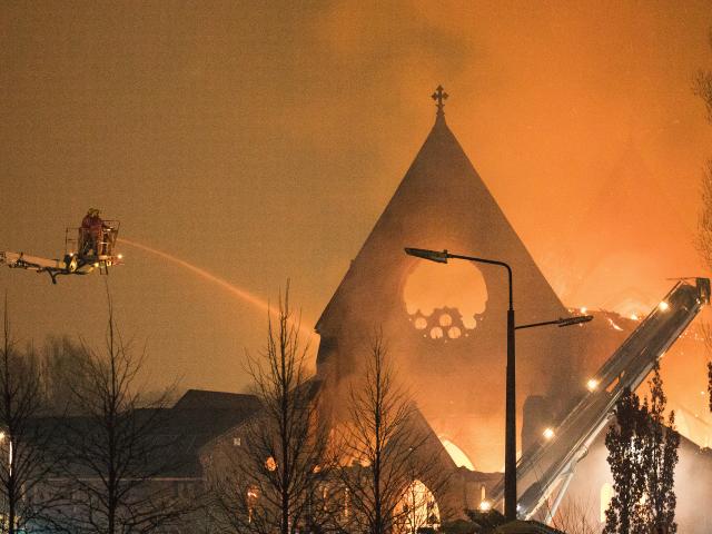 Exterior shot of Church of the Ascension, Salford, on fire.
