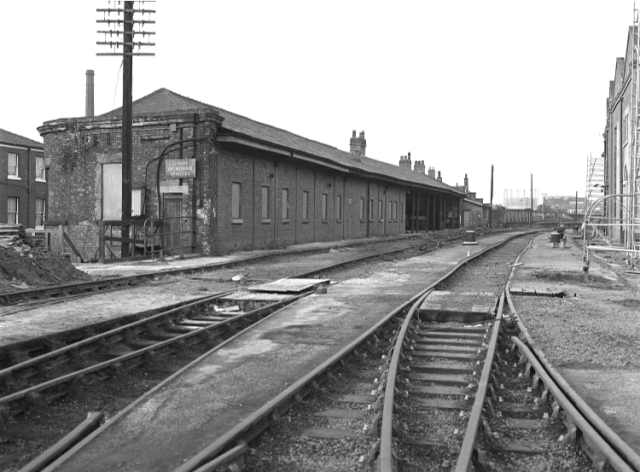 Historic photo of a railway station and track