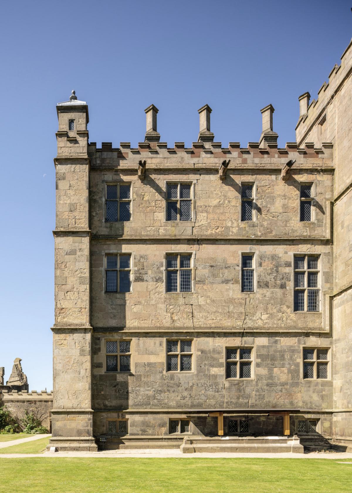 Exterior image of a Grade I listed castle with contemporary rainwater canopy.