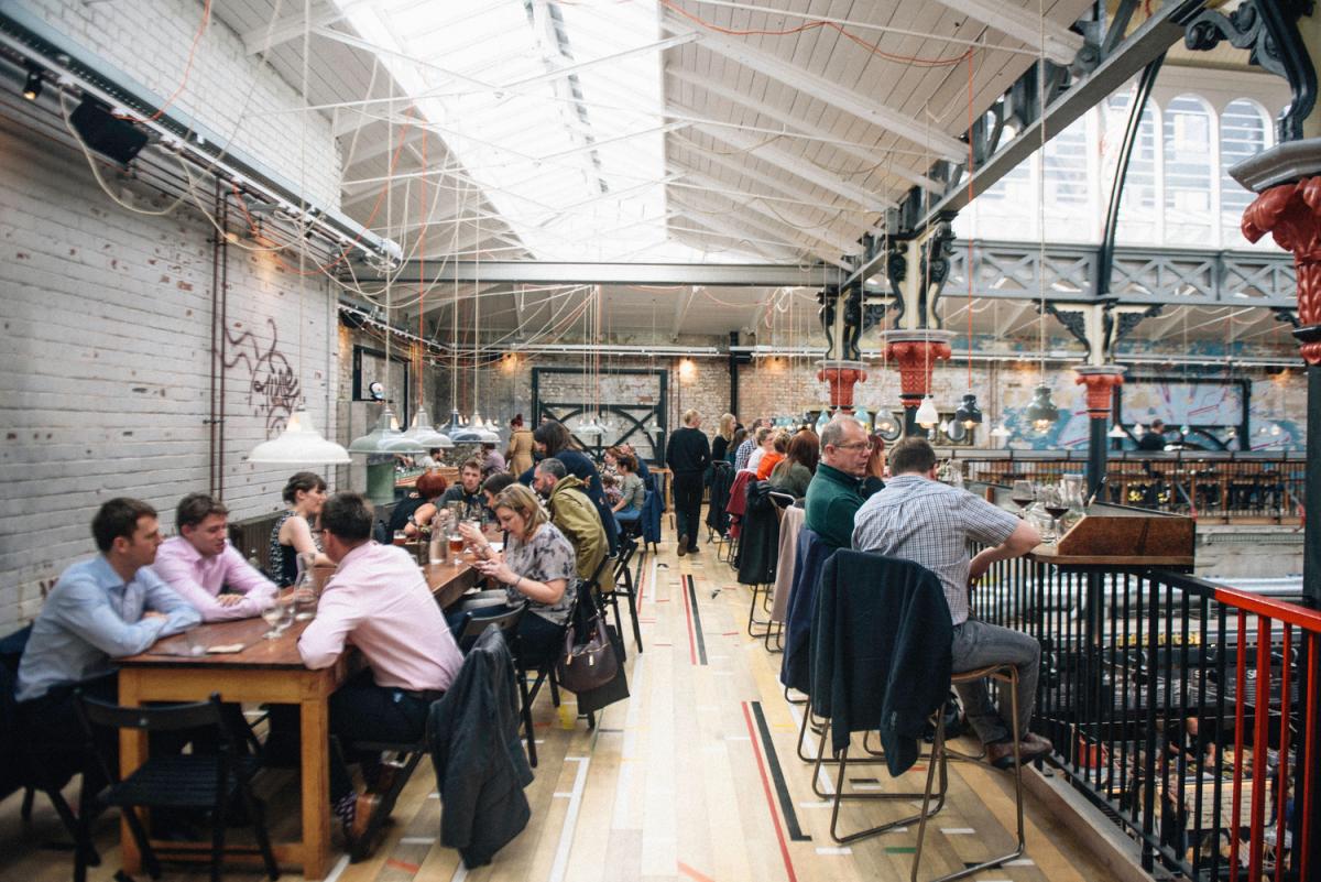 People eating in a dining hall.