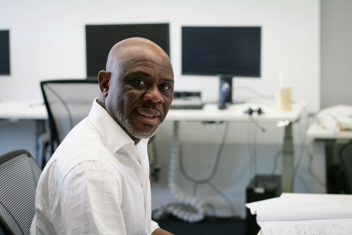 candid shot of dominic at desk in studio