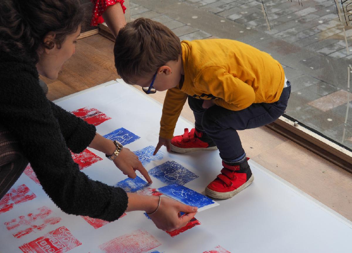 small child participating in arts and craft activity