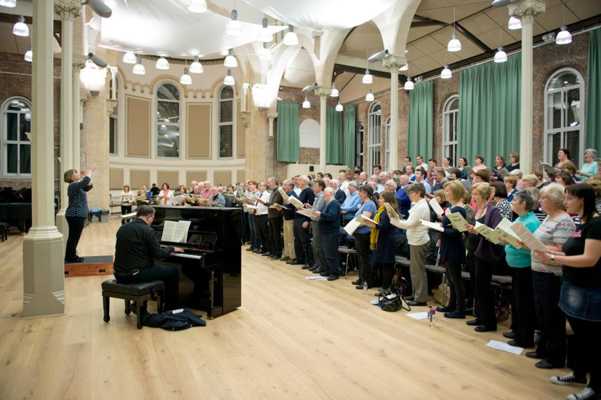 interior of halle st peters, large choir group and man on piano