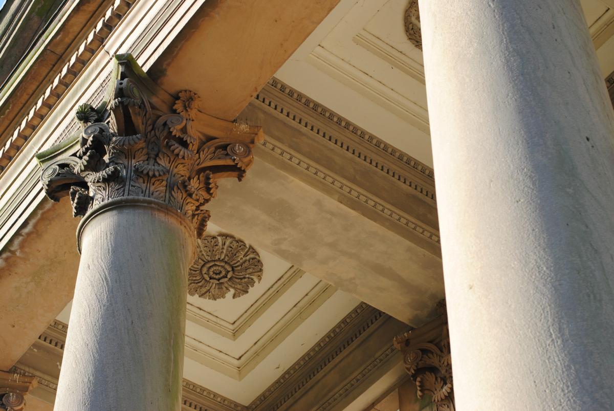 underview of heritage columns on historical building