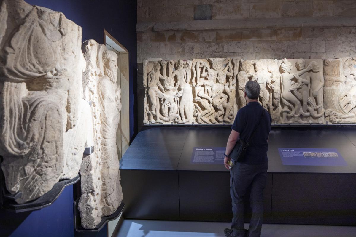 Man looking at exhibits in an exhibition space 