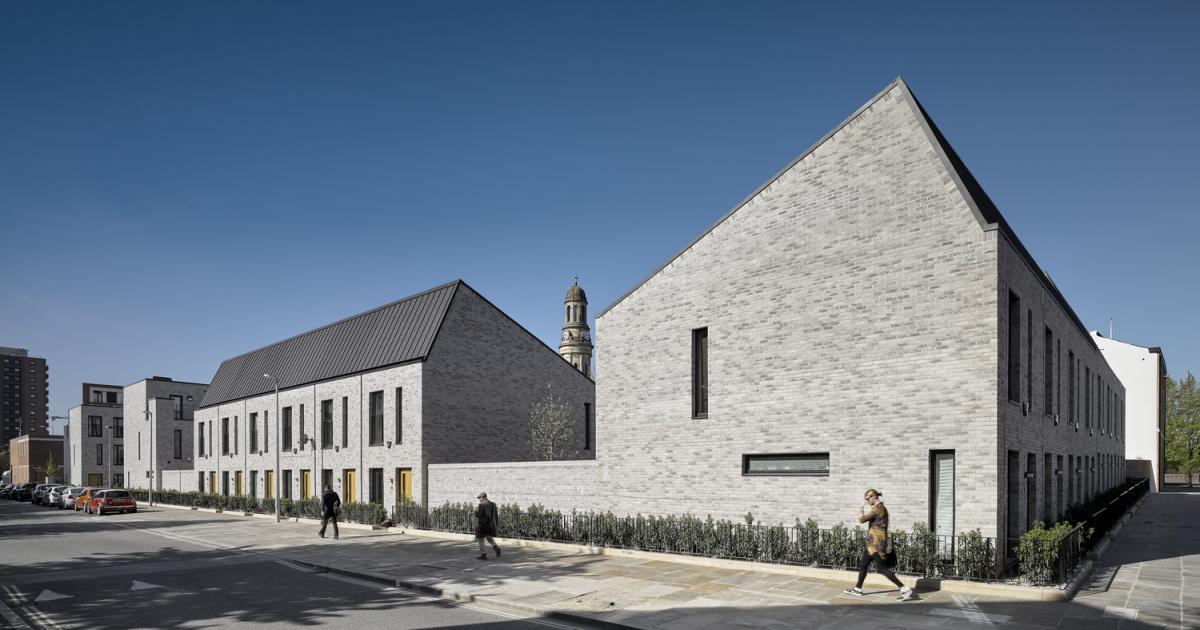 Exterior image of a row of modern townhouses.