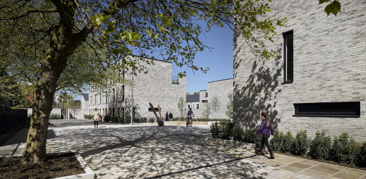 Exterior image of a row of modern townhouses.