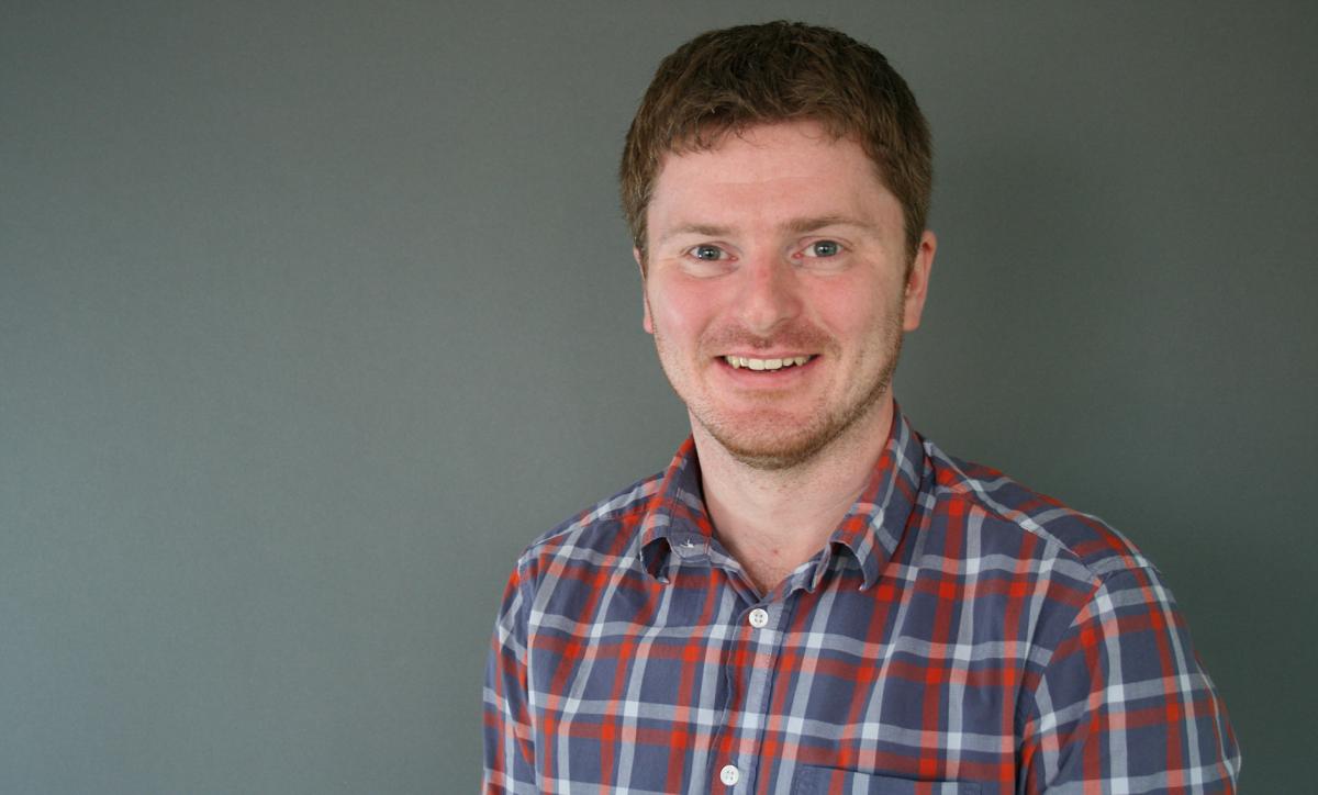 headshot of grant prescott, smiling