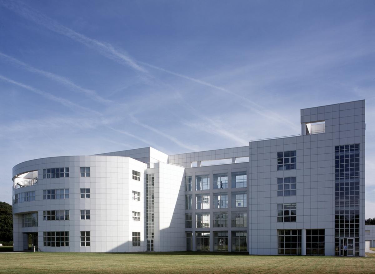 exterior of sir williams siemens house large white building with grass outside