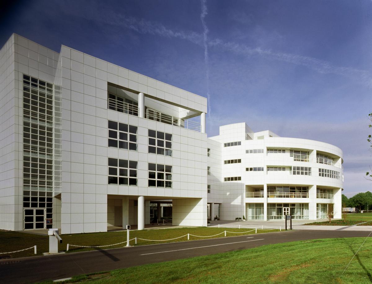 exterior of sir williams siemens house large white building with grass outside