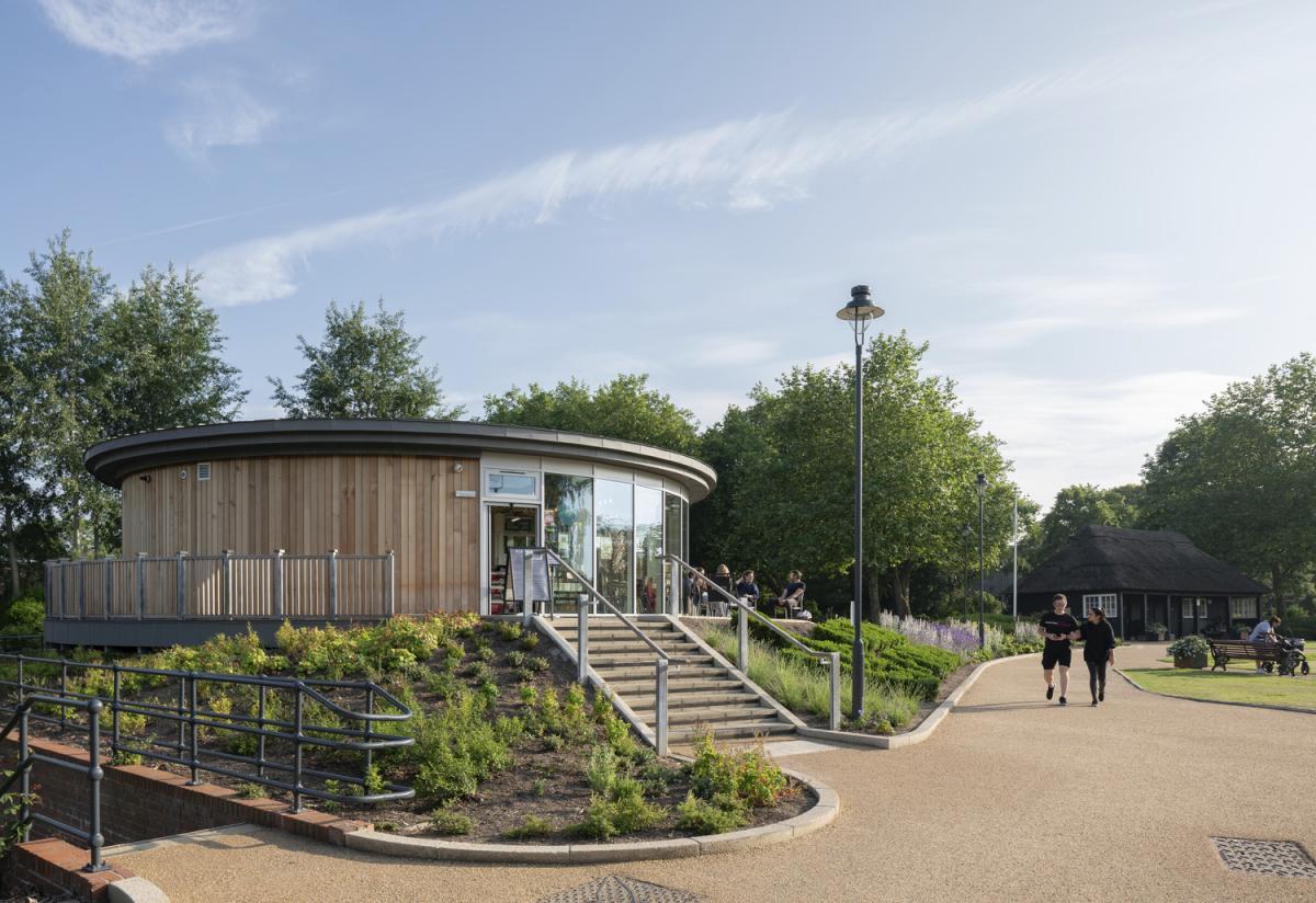 a circular building with steps to the glazed doors