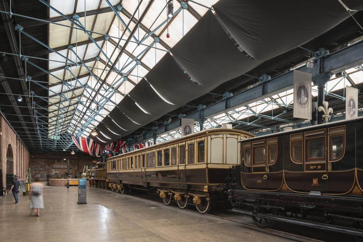 Image of an 1870s railway station hall and its collections at the National Railway Museum, York.