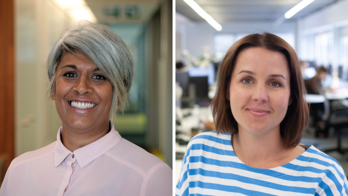 Two women in an office smiling 