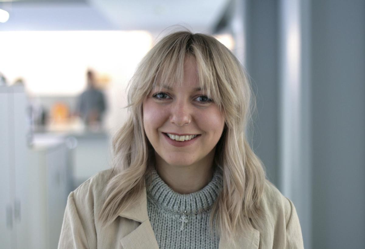 photo of a smiling woman in an office