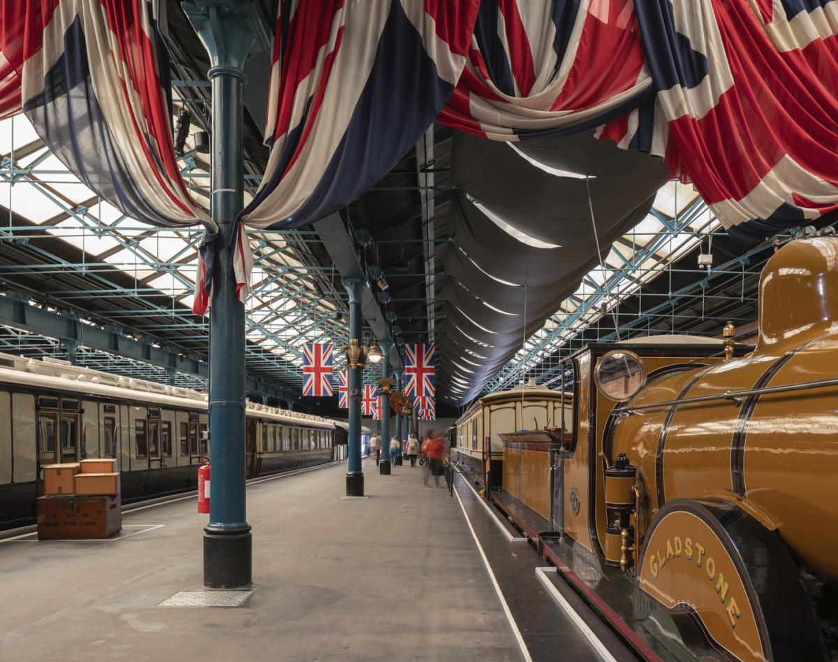 Old yellow train on display in an empty museum