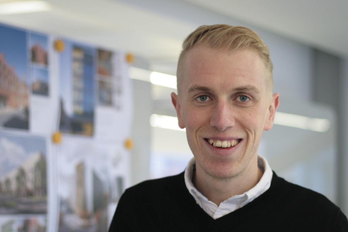 Man smiling in an office