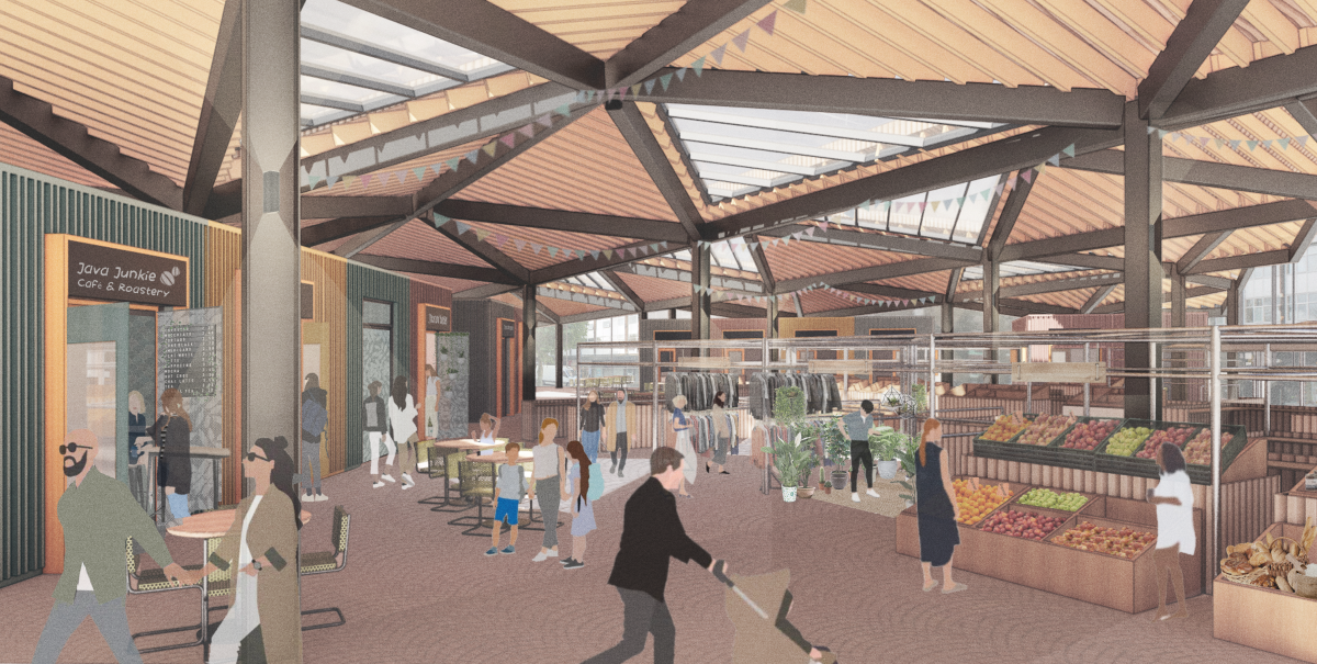 Covered market area with a triangulated roof, some triangles with opaque vents others with transparent vents.  Underneath the roof are people looking at market stalls of clothes and fruit and veg.  Others are sitting down at cafe tables.  On the left hand side are doors which lead to individual market kiosks, one selling coffee. 