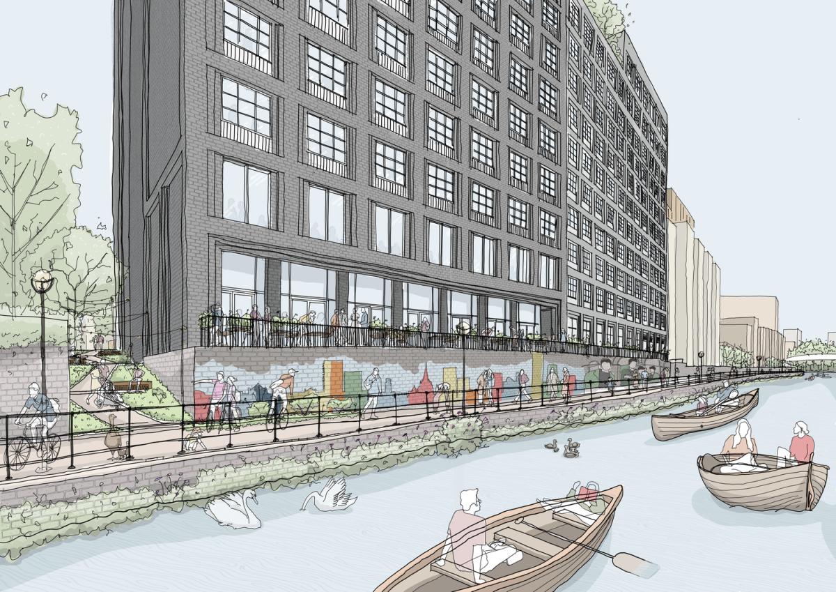 A grey building with windows beside a river. The river contains people on rowing boats.