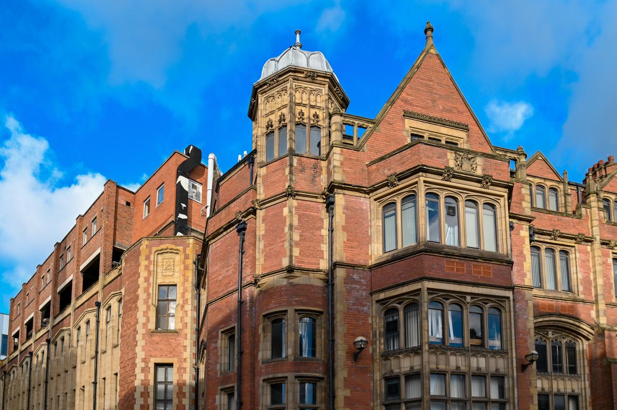 Red brick building against a blue sky