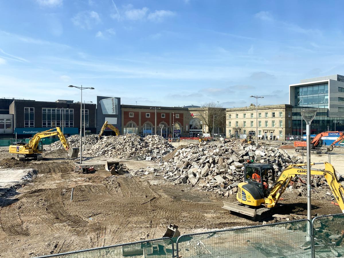 Ashton Market Square, construction site with two yellow diggers on each side of the photo.