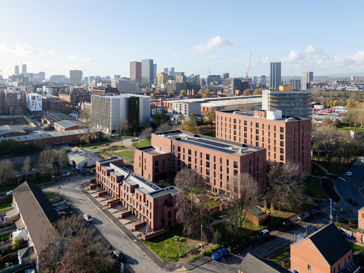 Exterior of red brick buildings from a drone perspective