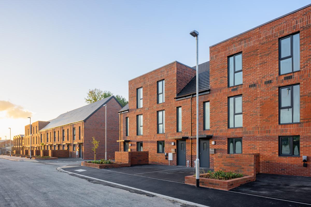 Row of red brick houses on a street