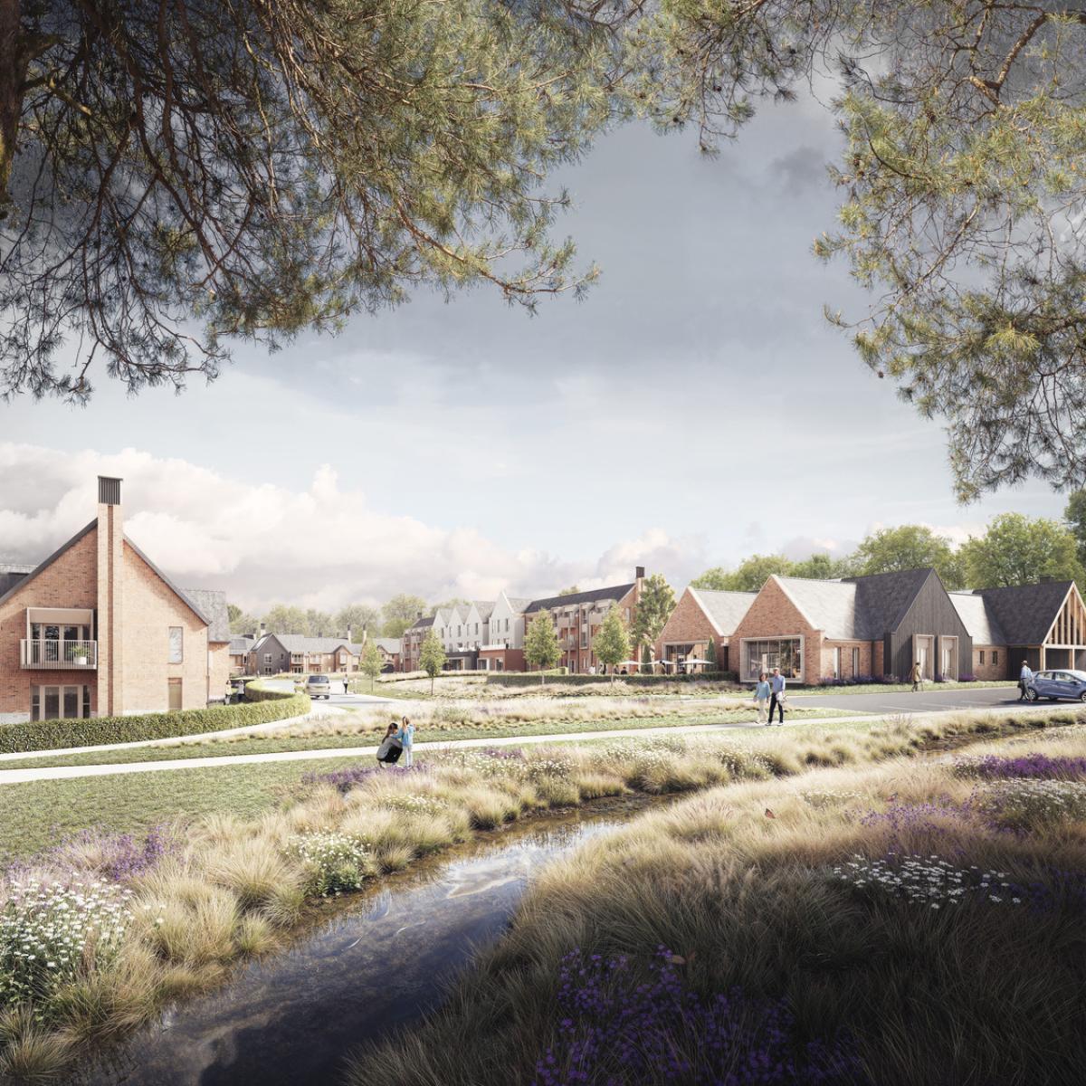 A peaceful CGI streetscape of a new residential development, showing modern brick homes and community buildings set around a landscaped green space. A small stream runs through the foreground with wild grasses and flowers along its banks. A few people walk along footpaths, and large trees frame the scene under a bright, lightly clouded sky.