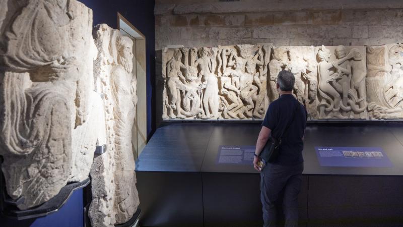 Man looking at exhibits in an exhibition space 