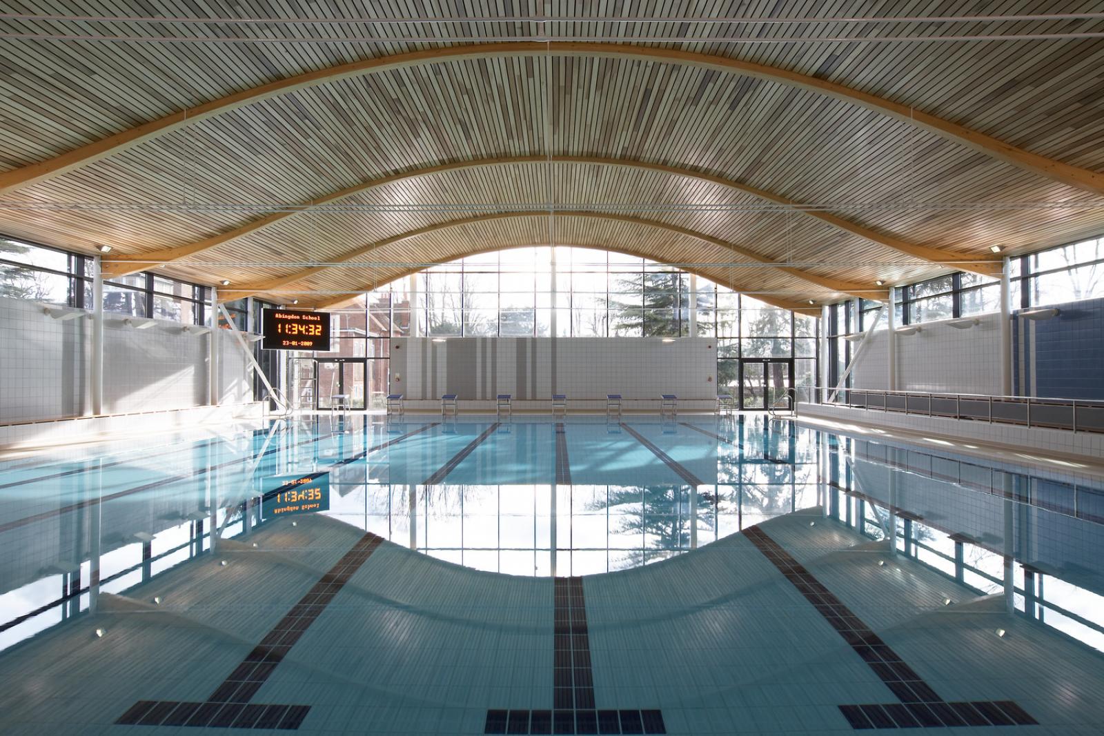 Interior image of an eight lane swimming pool.