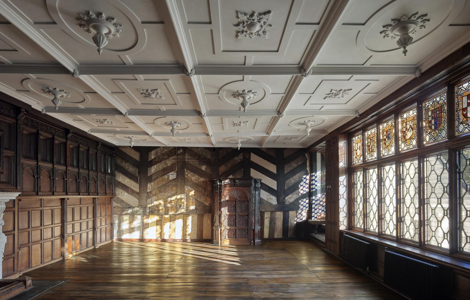 Interior of a 16th century manor house. The building, which was destroyed by fire, has been restored. Light is filtering through the window.