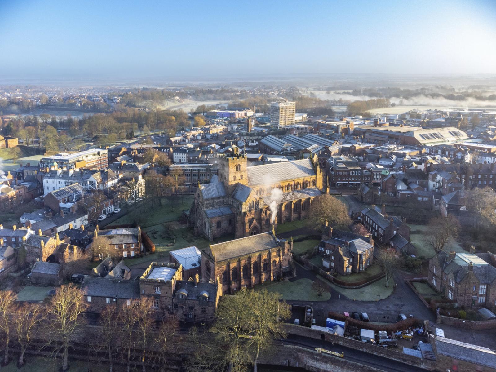 Aerial image of the Grade I listed Carlisle Cathedral.