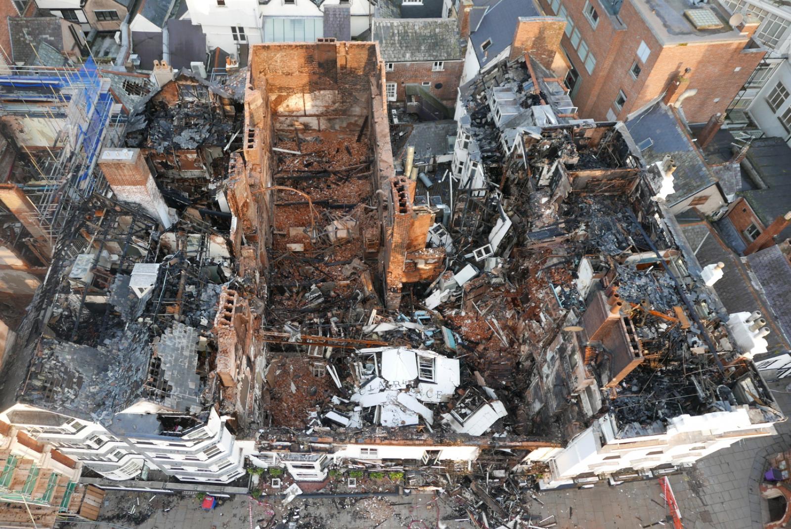 an aerial view of a fire damaged building