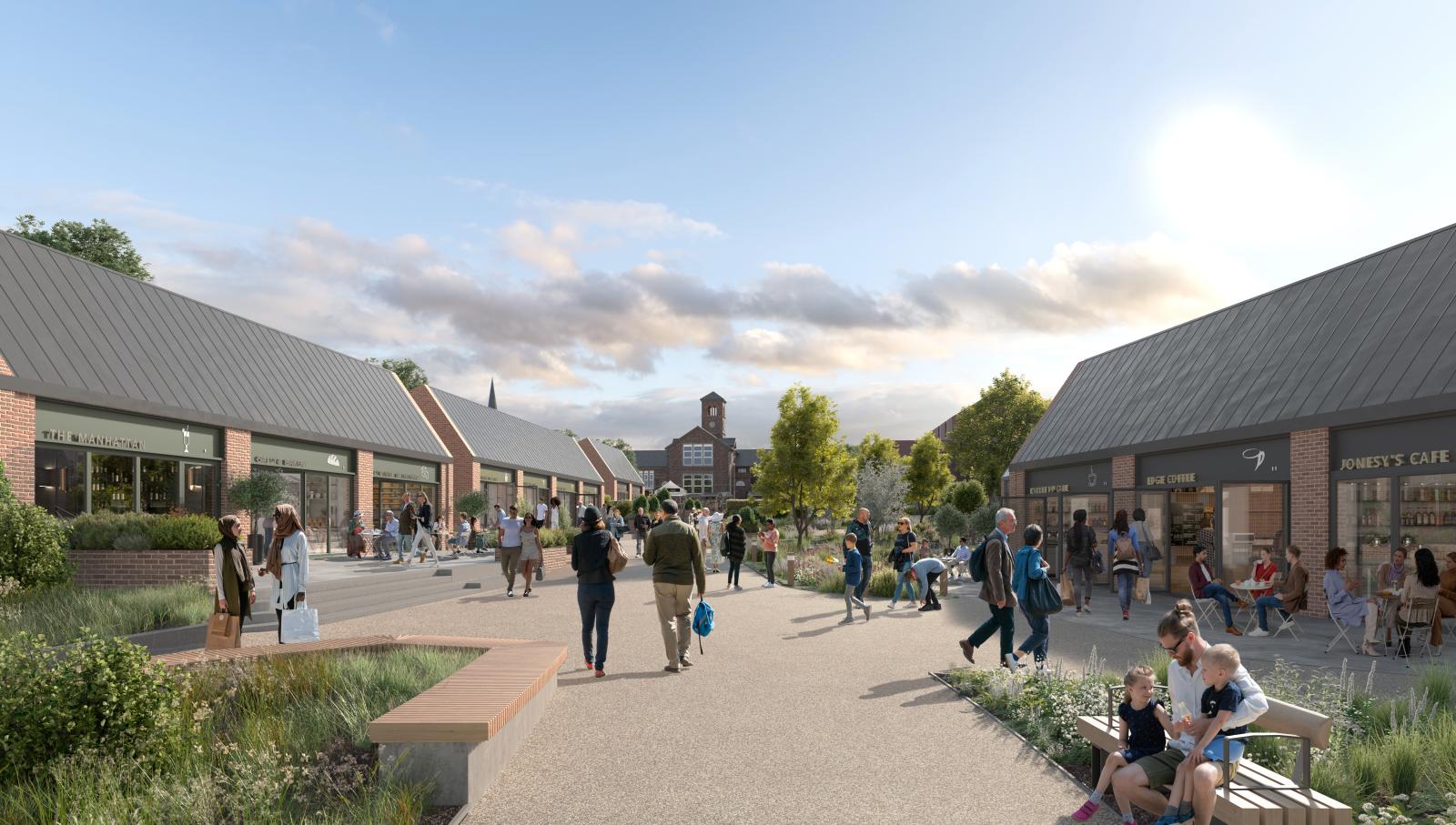 Image of a outside pedestrian street. On the right is a red/pink brick building offering an outdoor cafe.  There's a similar building on the left.  There two areas of planted greenery where people are sitting and enjoying the area. 