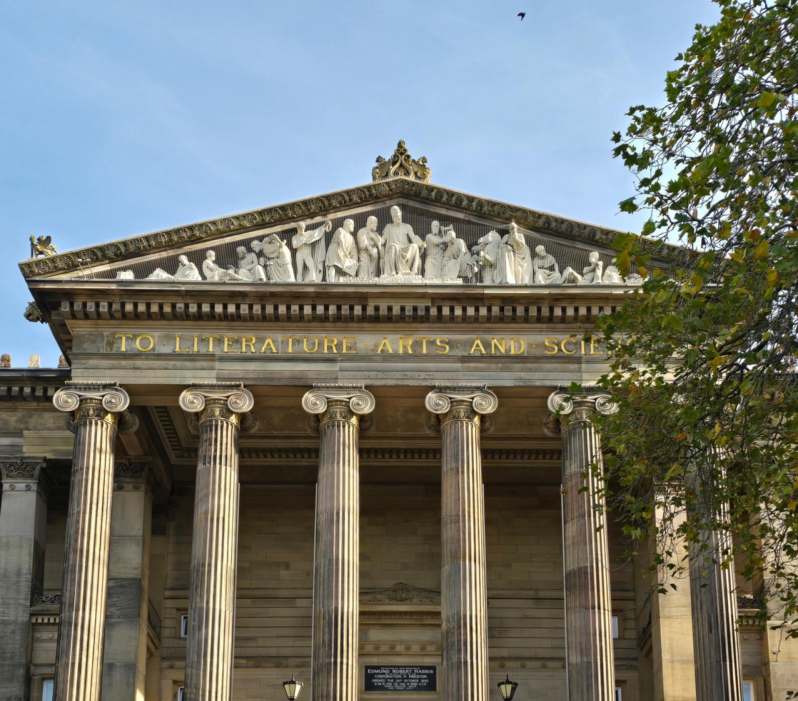 The Harris - a building with columns on a street setting