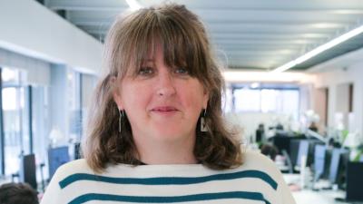 photo of liz jackson wearing a striped blue and white jumper