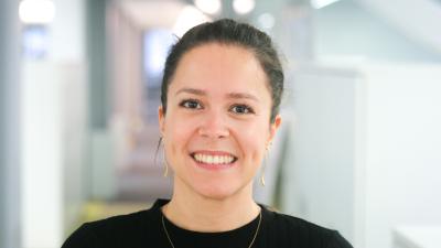 Headshot of Bruna Da Silva, a woman wearing a black tee.