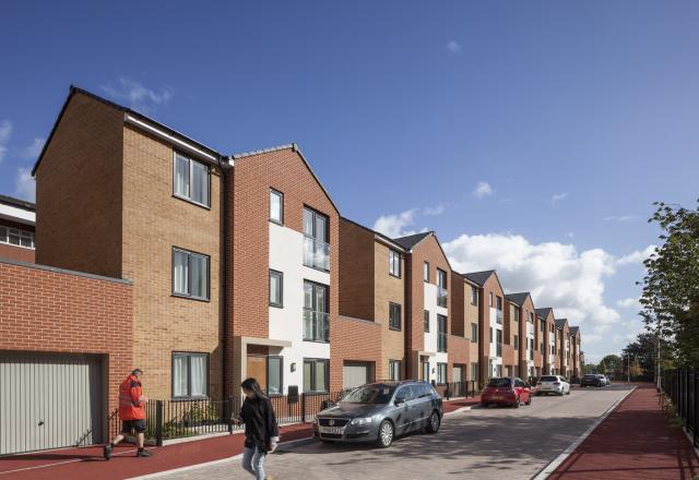 Exterior image of a row of new build houses.
