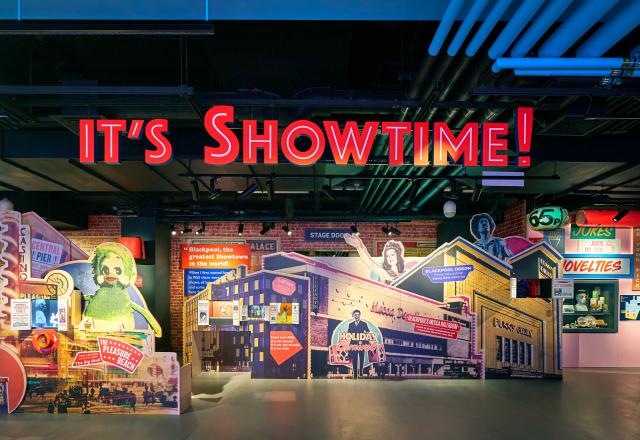 Colourful and sparkling seaside shop front (within the museum) with the text on the shop front reading It's Showtime!