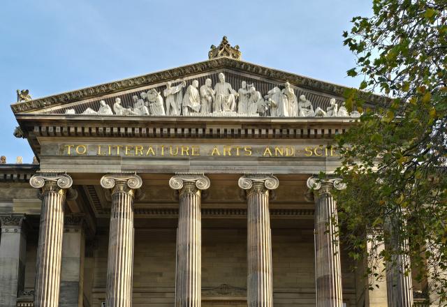 The Harris - a building with columns on a street setting