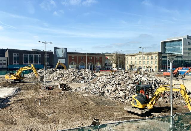 Ashton Market Square, construction site with two yellow diggers on each side of the photo.