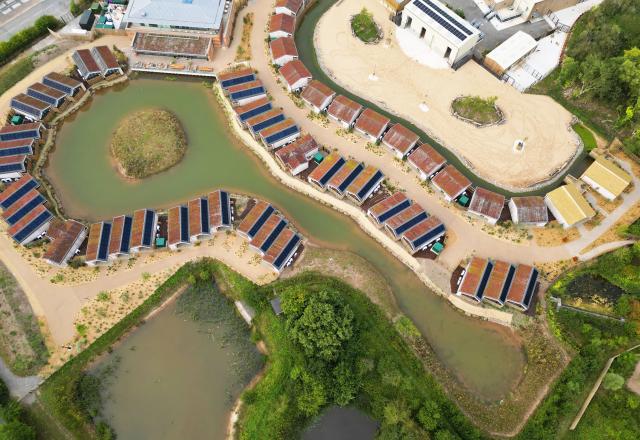 Drone shot of Chester Zoo lodges around a lake