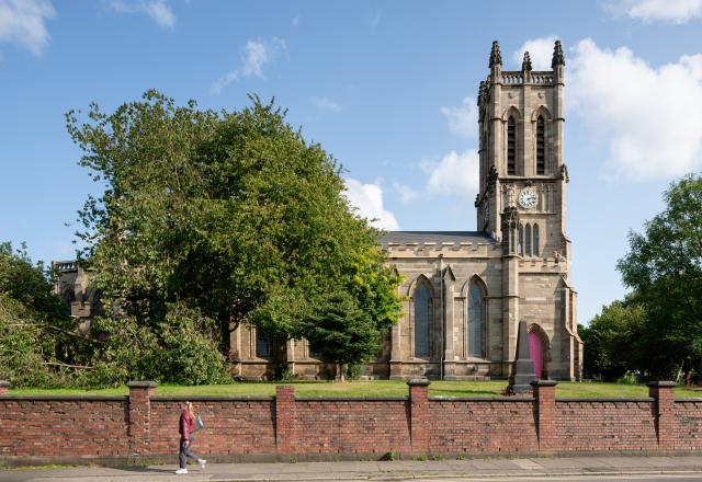 St Marks church - a traditional church building with a tower and pink door.