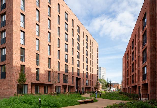 Photography of No.1 Ancoats Green - a red brick residential building with exterior landscaping