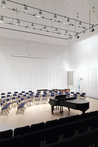 a white auditorium of a music school