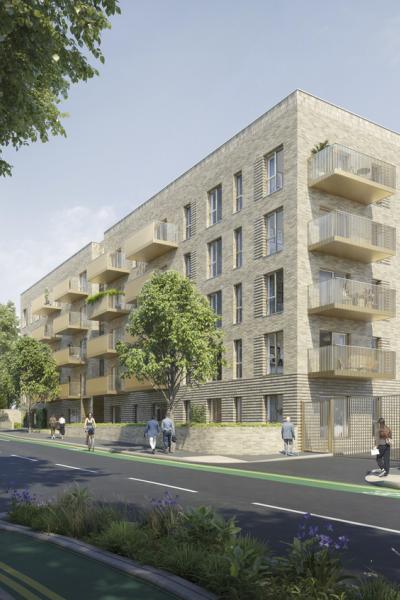 Long, five storey apartment block on a tree lined street