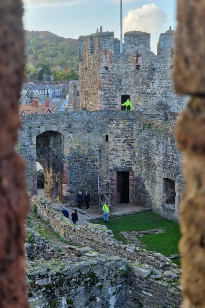 Heritage Consultants in hi-vis investigate Conwy Castle